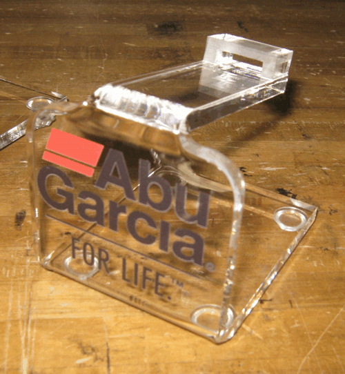 Clear acrylic business card holder with “Abu Garcia for life” printed on the front.