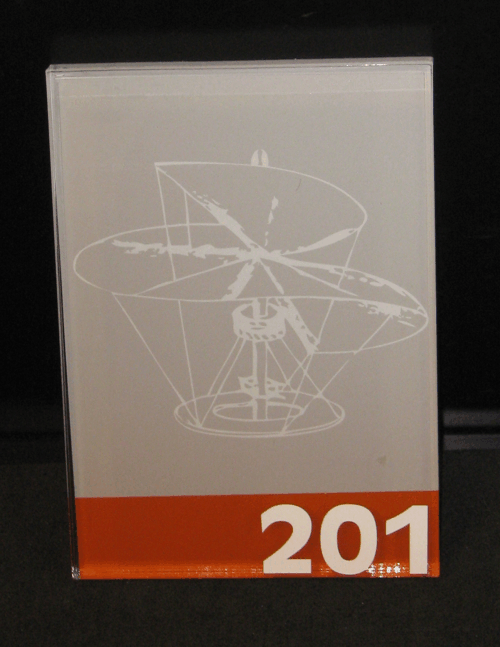 White schematic drawing on gray panel above orange strip labeled “201”