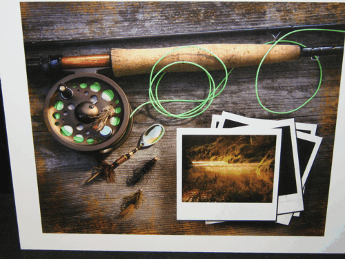 Fishing gear and instant photos on a rustic wooden table, with a reel, line, and lures.