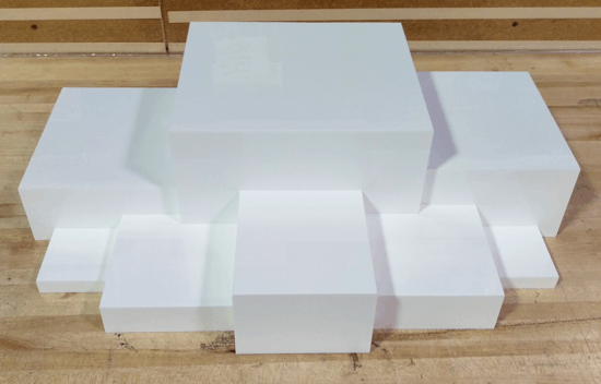 Stacked translucent white plastic blocks on a wooden surface