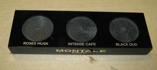 Black makeup palette with three shades labeled Roses Musk, Intense Cafe, and Black Oud
