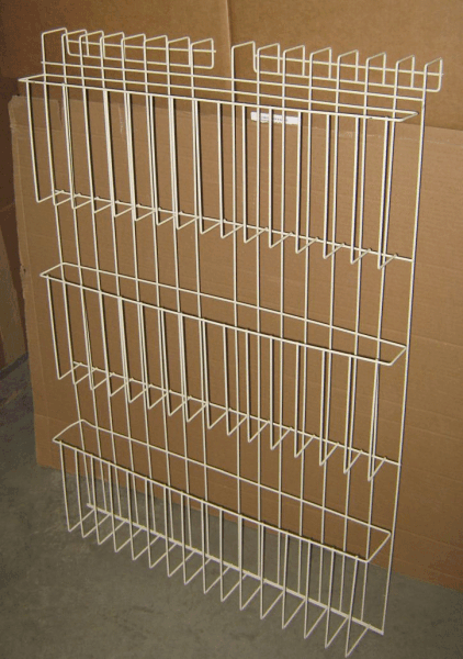 White wire rack shelf mounted against a brown cardboard wall.
