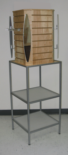 Wooden cabinet mounted on a gray metal stand in a plain indoor room