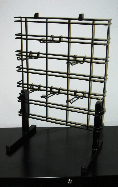 Metal wire display rack on a black base against a plain background