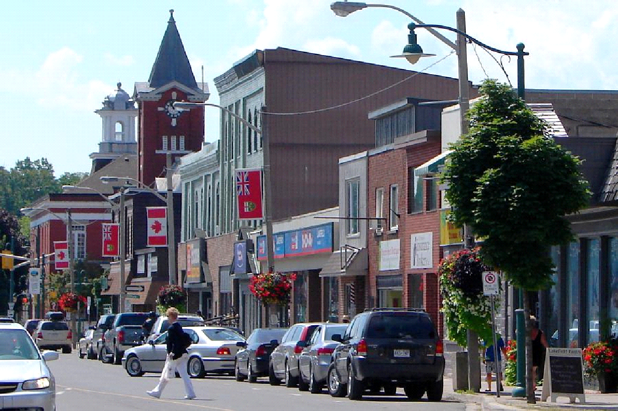 A city street with a clock tower in the background