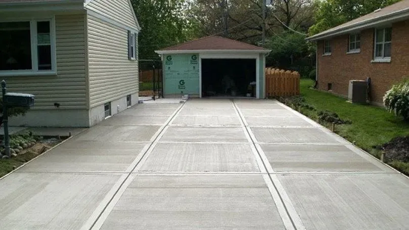 Textured broom finish square cut concrete driveway
