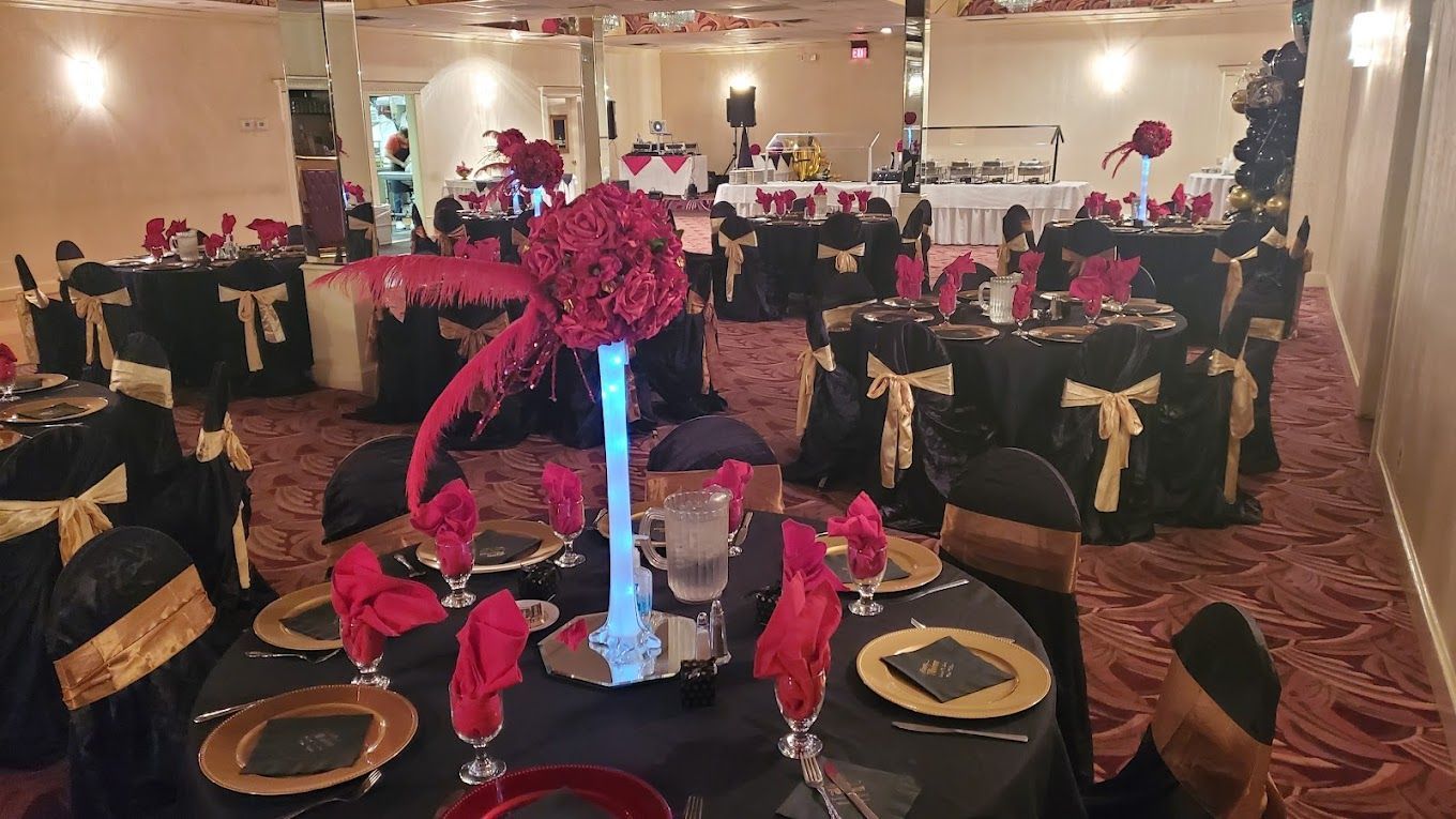 A large room with tables and chairs set up for a party