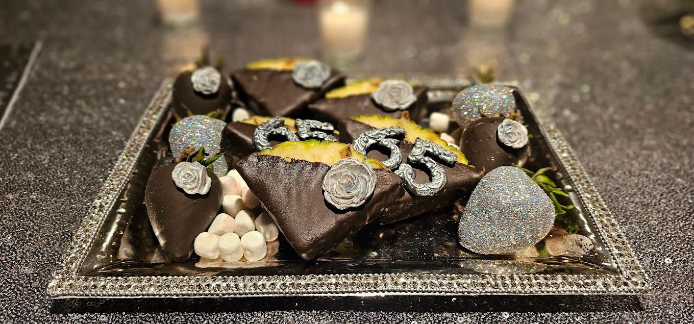 A close up of a plate of food on a table with candles in the background
