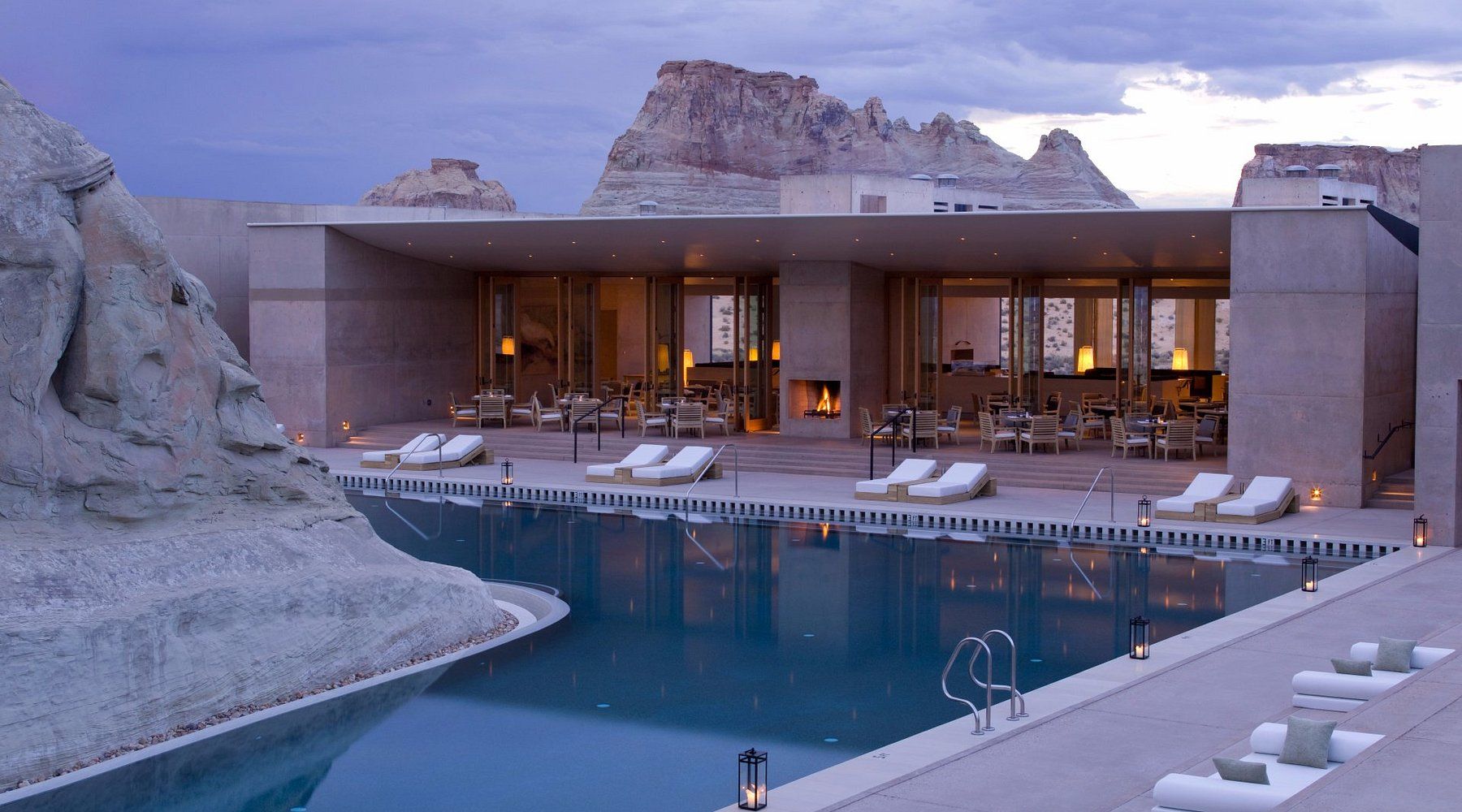 A large house with a swimming pool in front of it