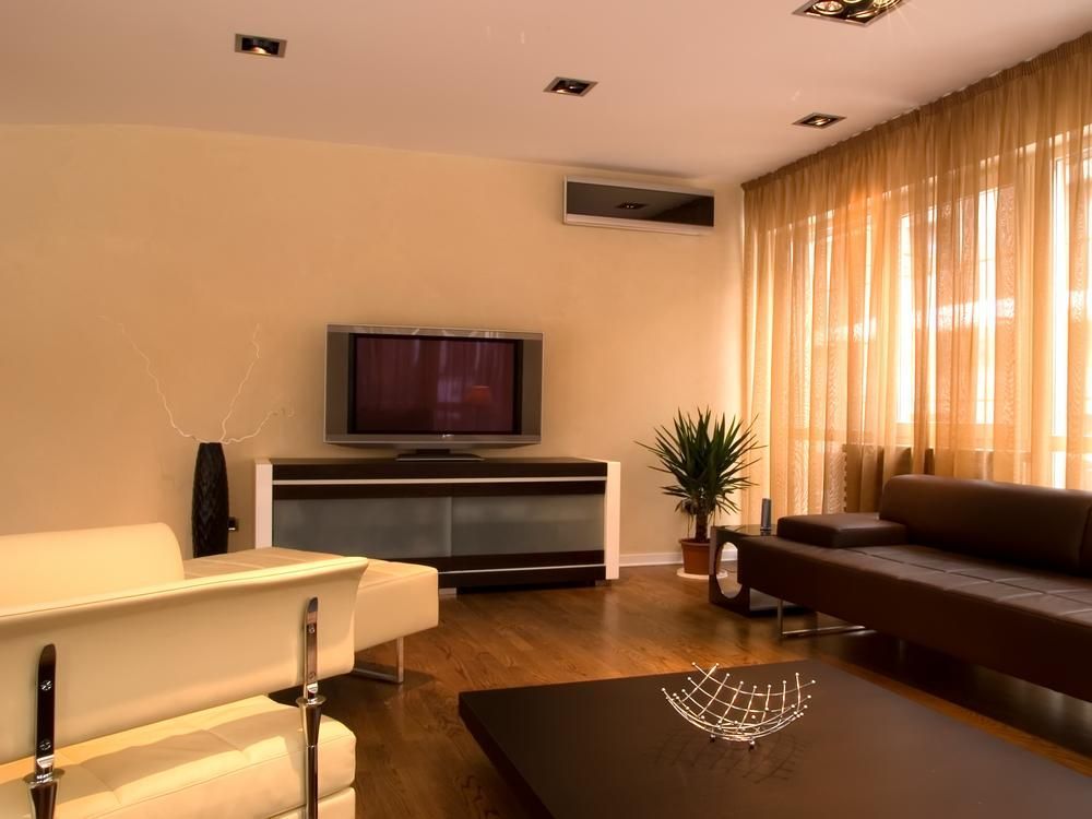 A Living Room With A Couch And A Flat Screen Tv — Custom Air In East Albury, NSW