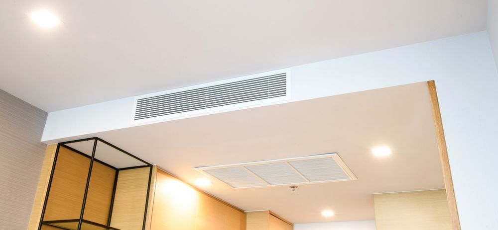 A Room With A Cassettes Air Conditioner And A Shelf In It — Custom Air In Yackandandah, NSW