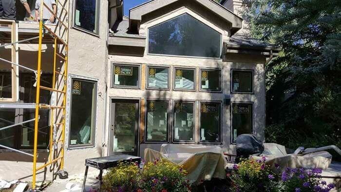 home exterior renovation with large custom windows