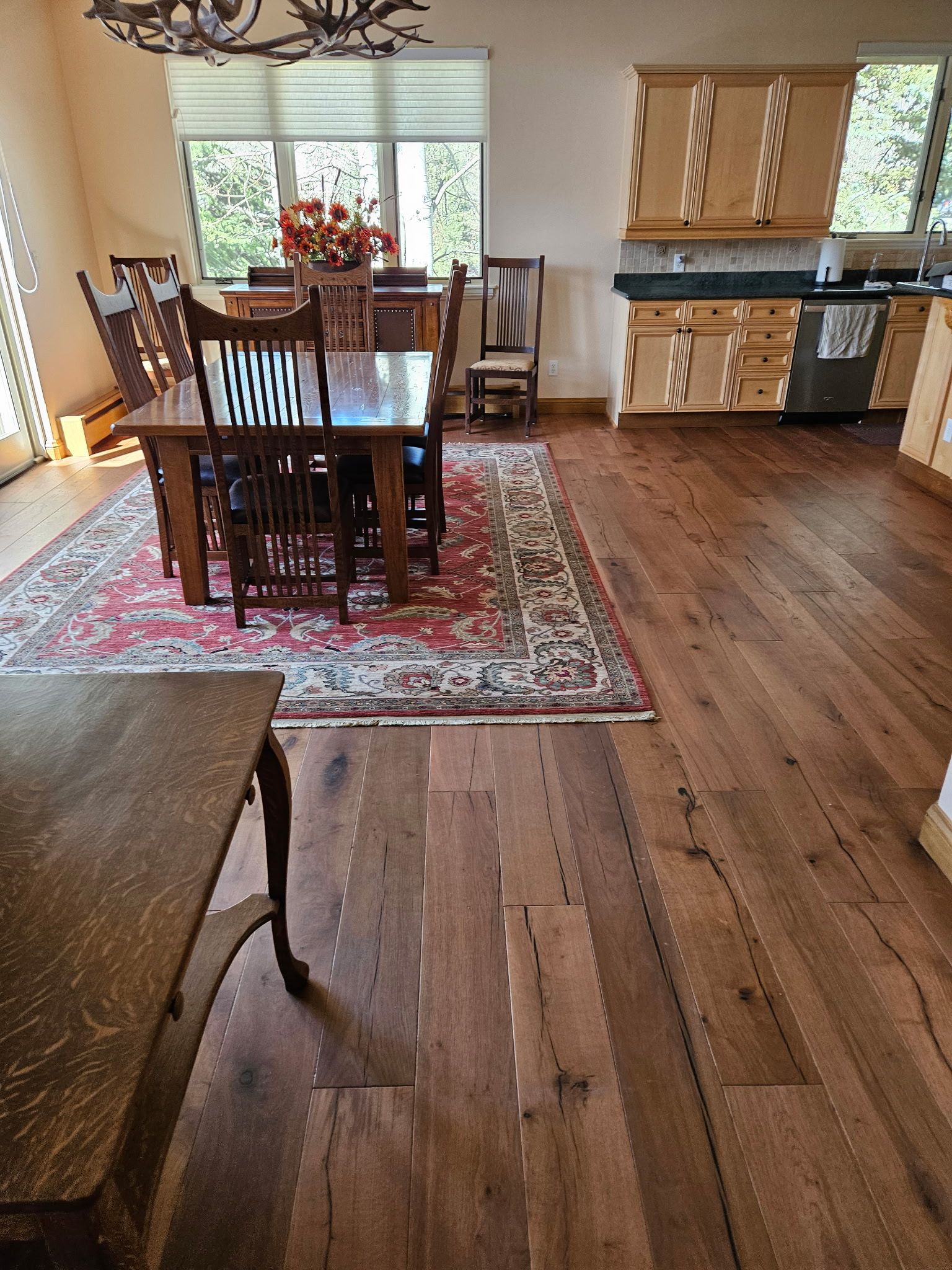 open dining space with custom wood kitchen cabinets