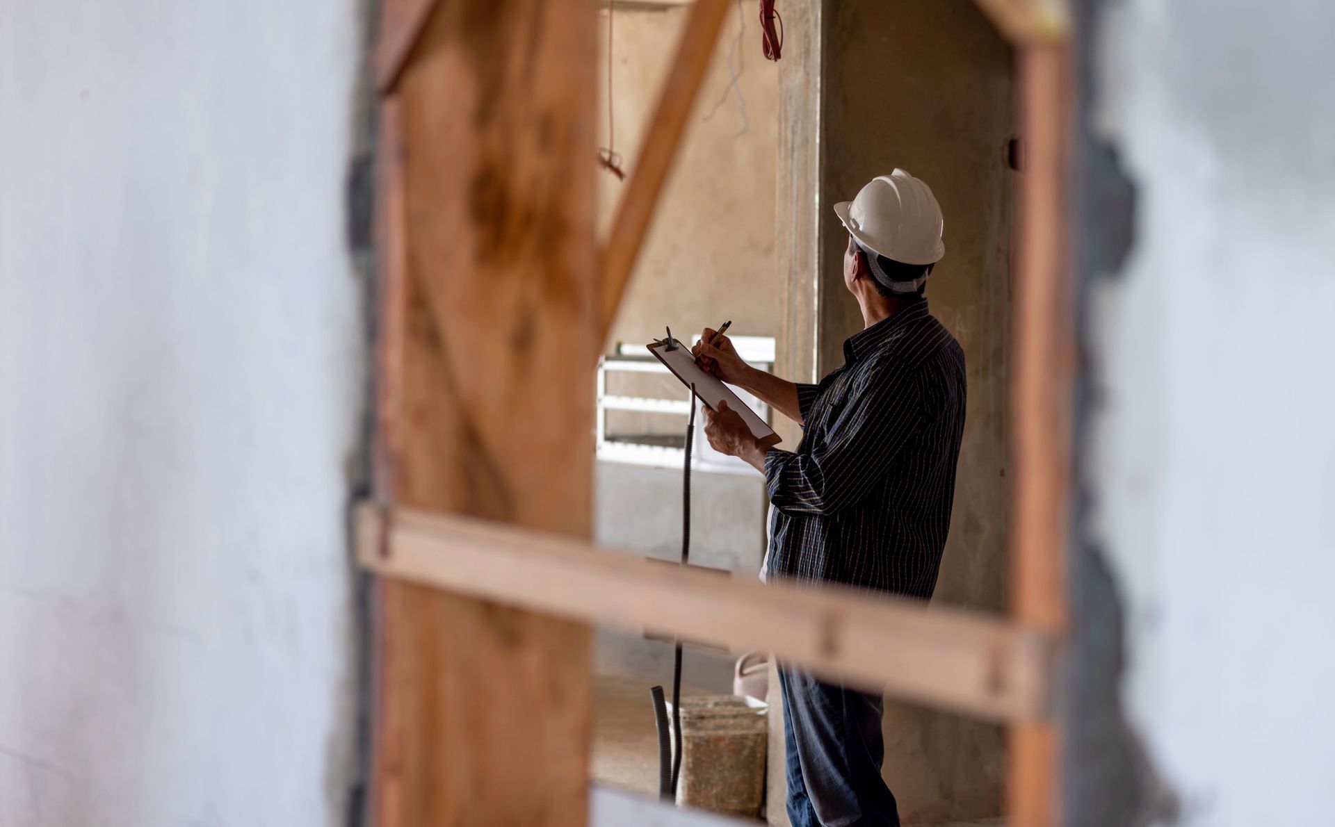 Man Fixing Something In The House | Richmond, VA | Walker & Frick Construction Man Fixing Something In The House | Richmond, VA | Walker & Frick Construction