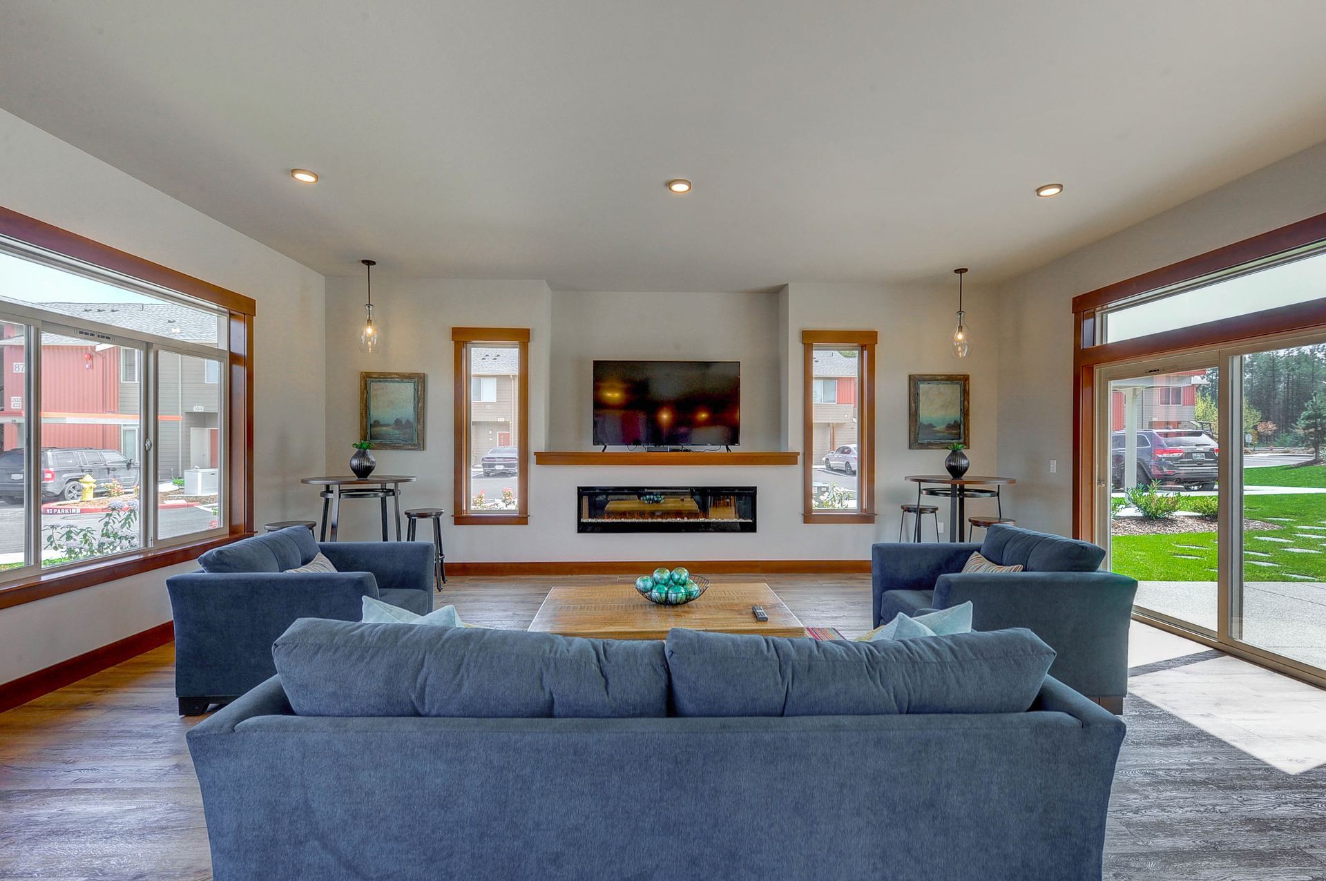 a living room with a fireplace and a flat screen tv
