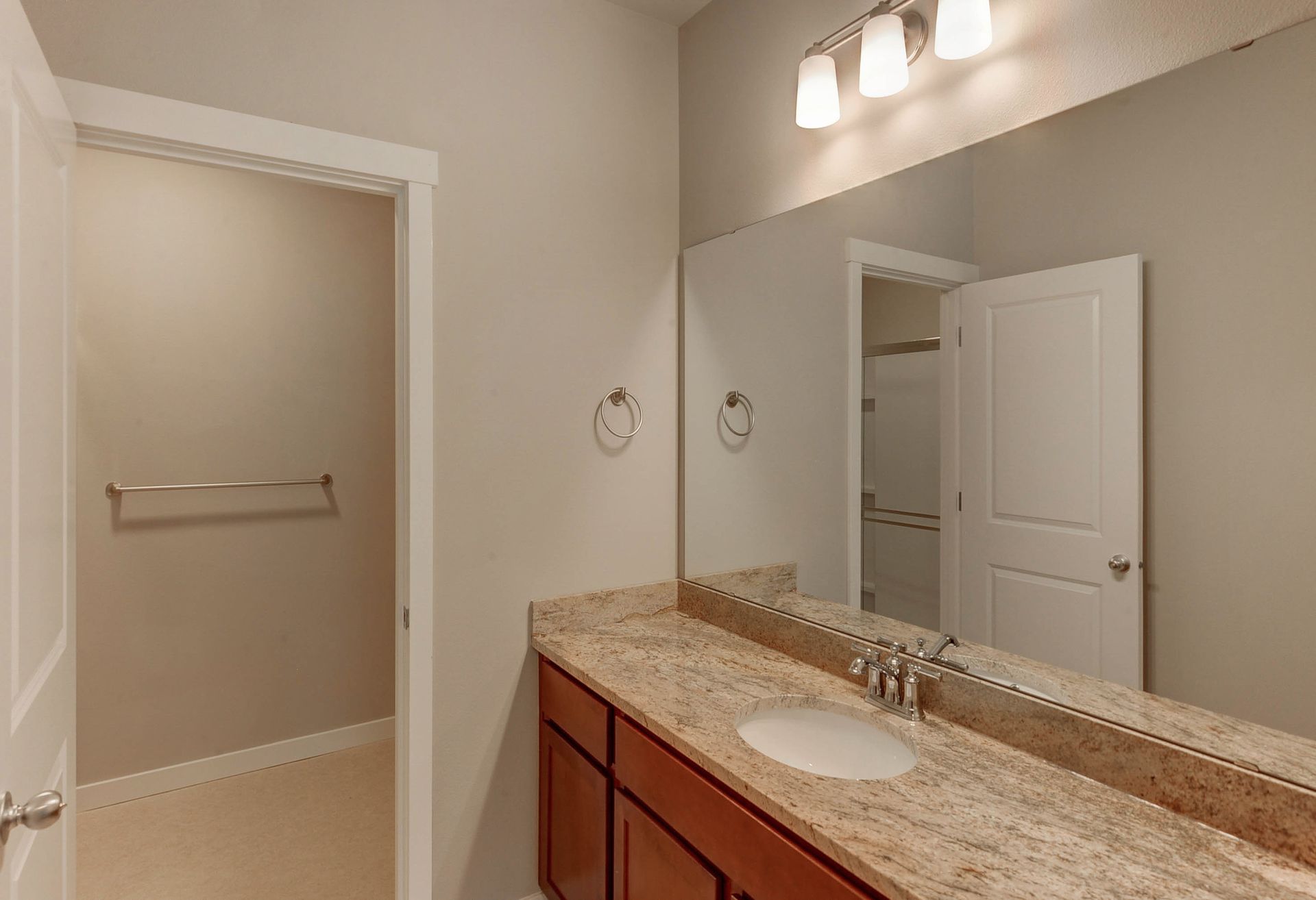 a bathroom with a sink and a large mirror