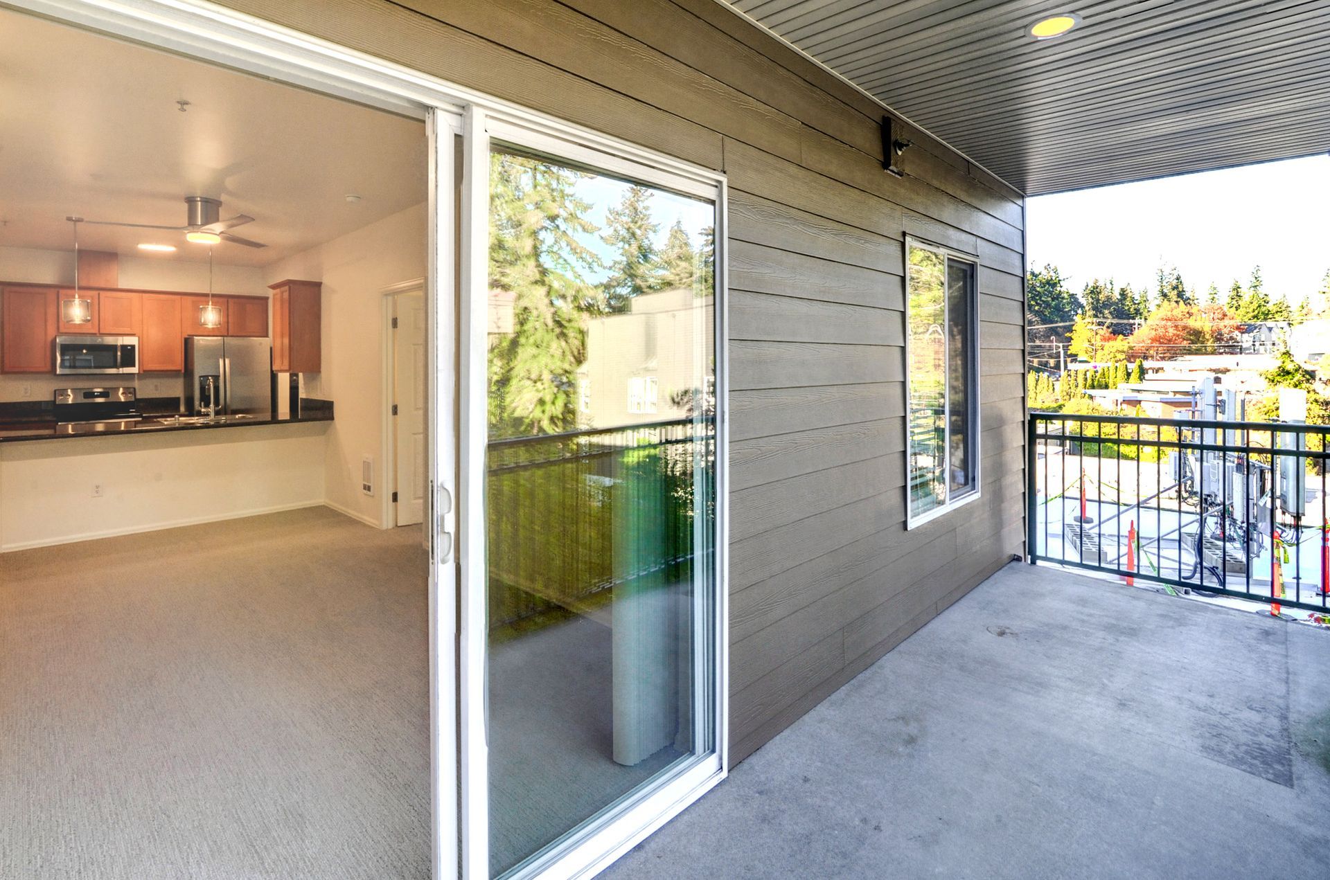 a sliding glass door opens to a balcony in a house
