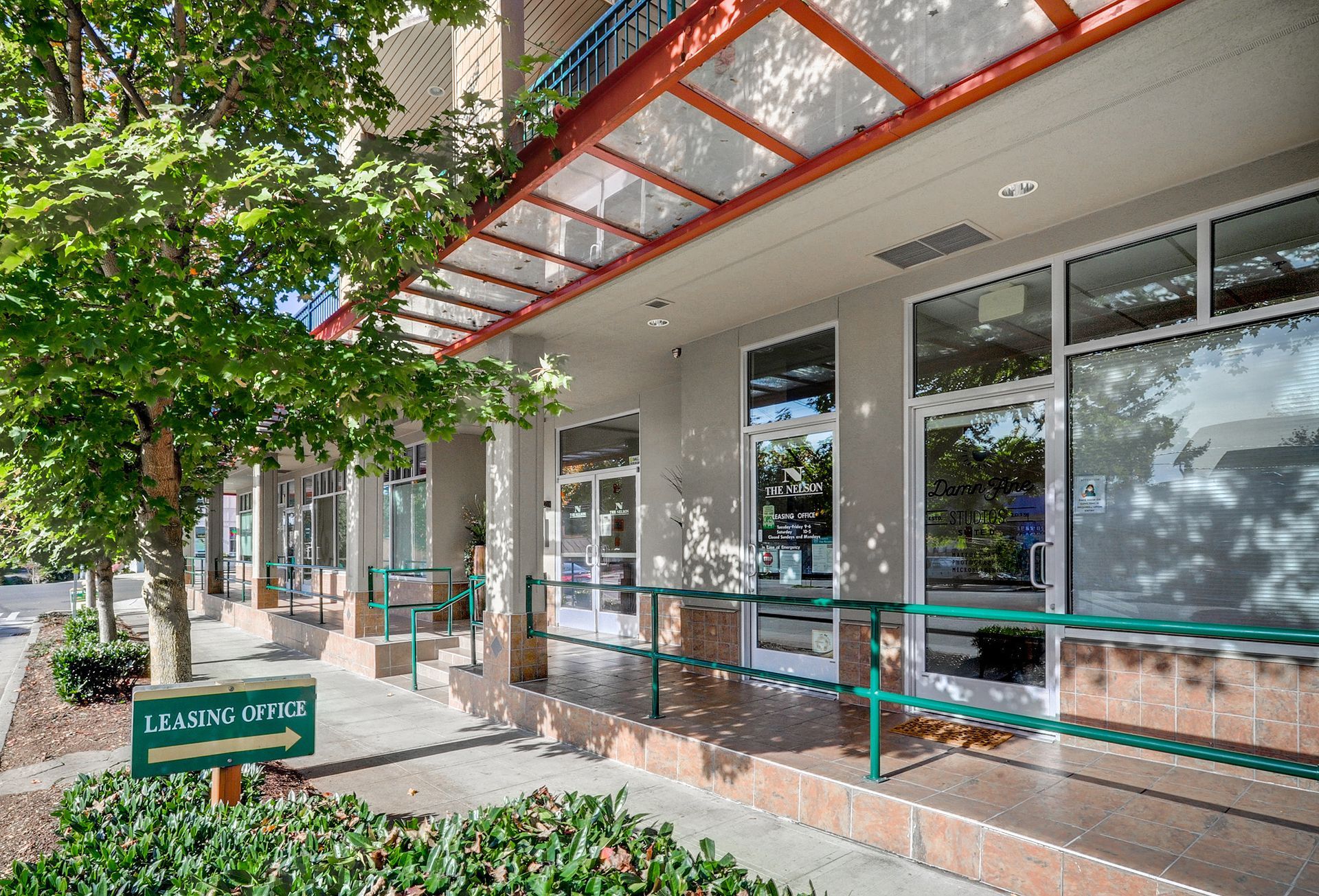 the front of a building with a sign that says ' landscaping ' on it .