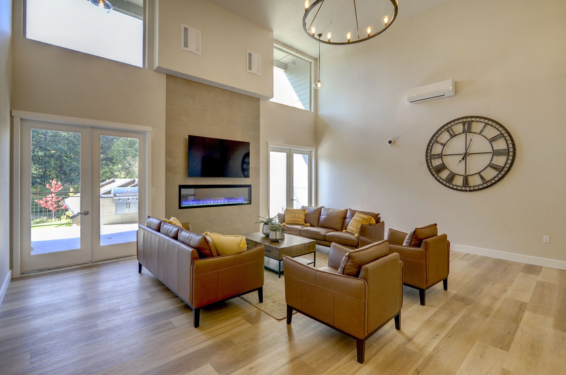 a living room filled with furniture and a clock on the wall .