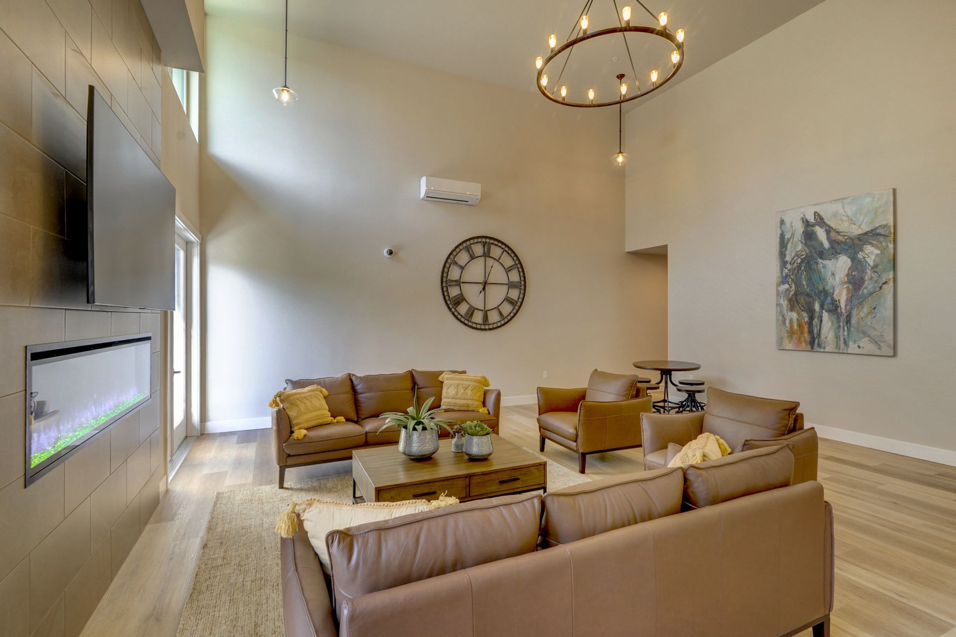 a living room filled with furniture and a clock on the wall .