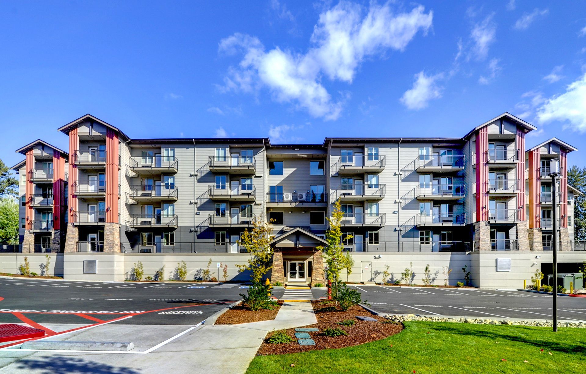 a large apartment building with a lot of windows and balconies