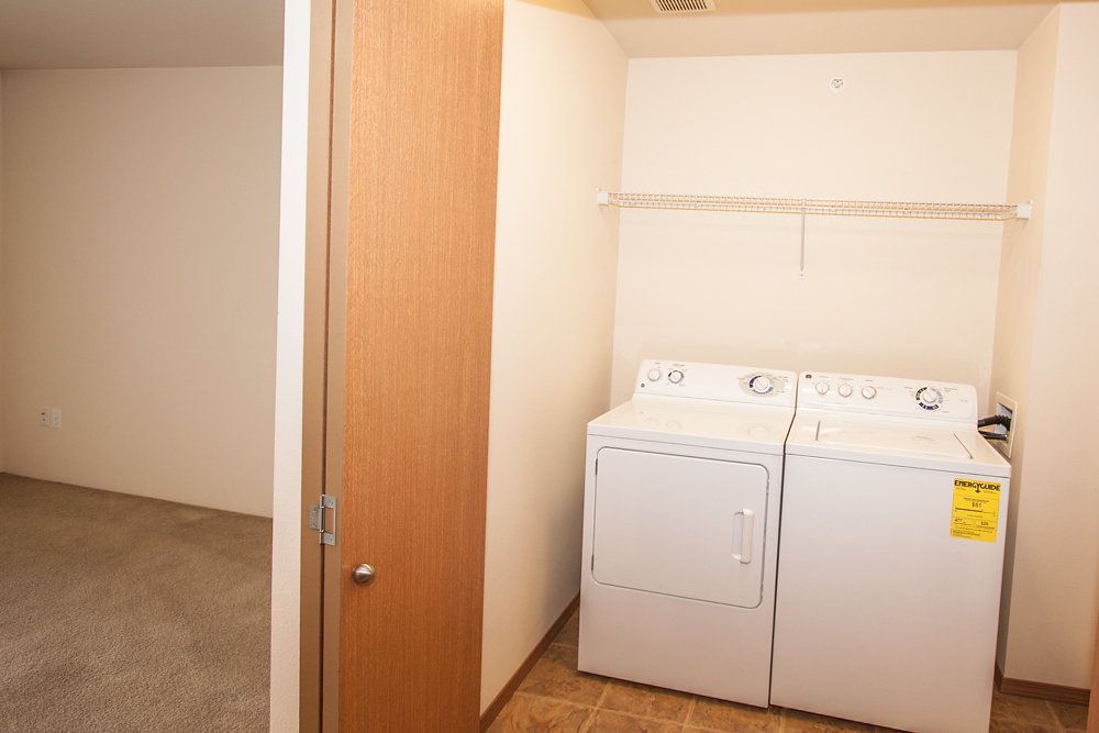 a washer and dryer in a laundry room with a sticker that says energyguide