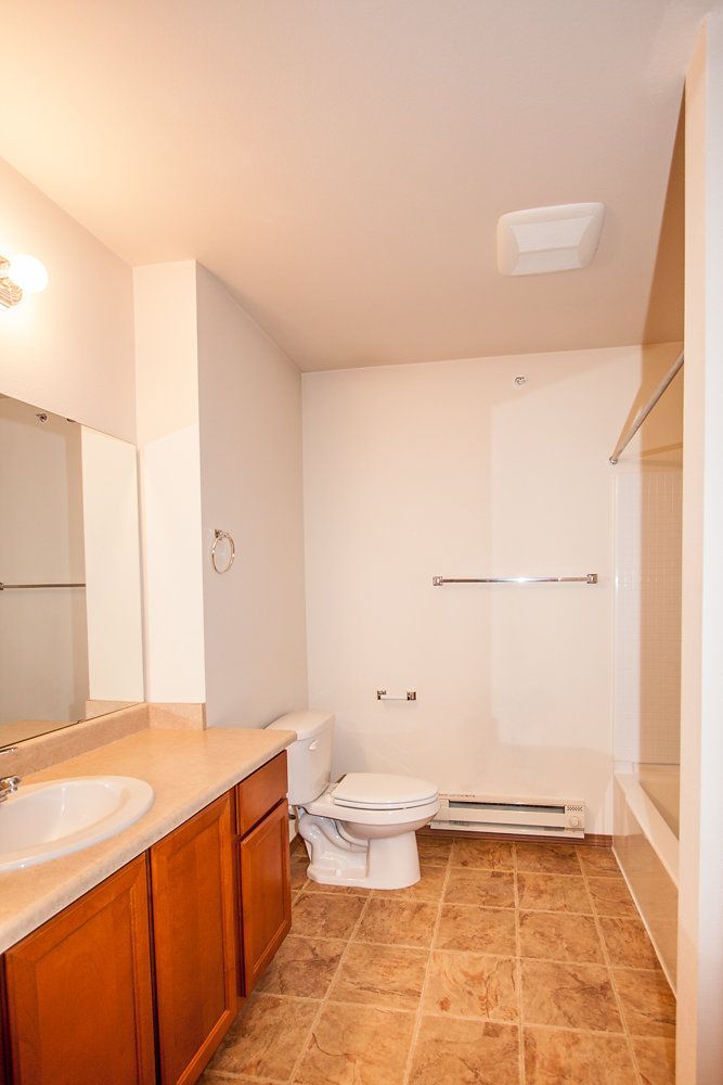 a bathroom with a toilet a sink and a bathtub