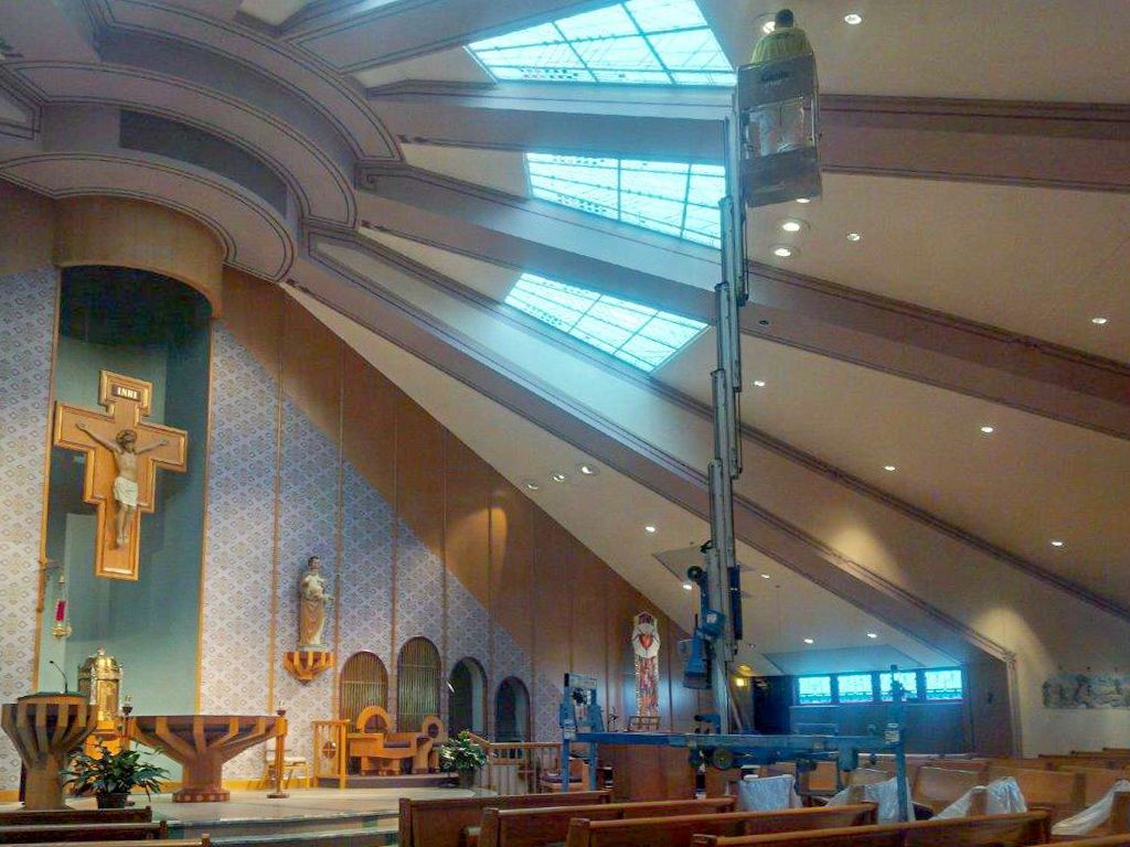 A large church with a cross in the middle of it