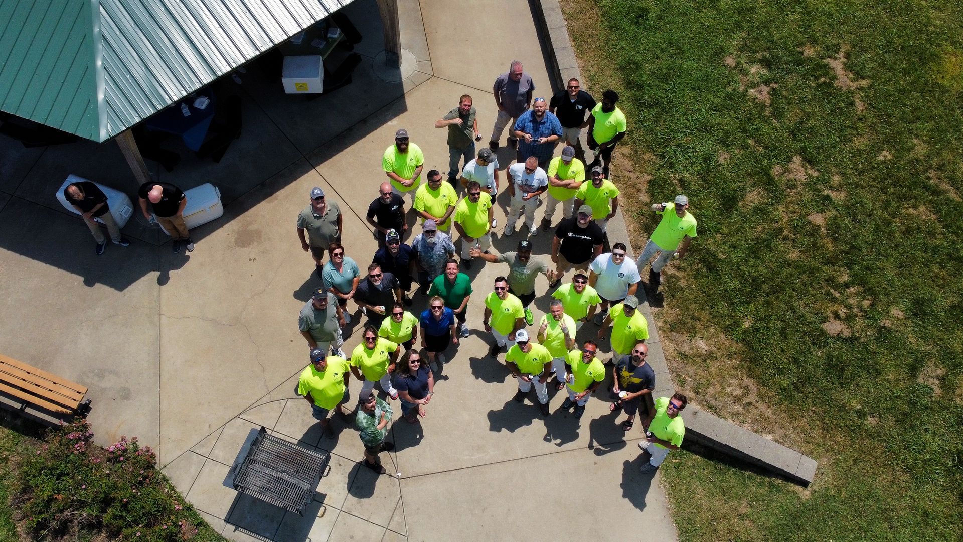 An aerial view of a group of people standing in a park.