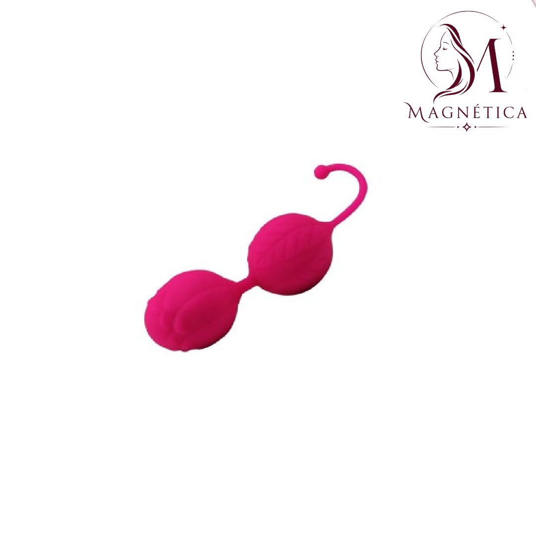 Sujetador de pezón de silicona rosa con cierre de gancho sobre fondo blanco, logotipo de Magnolia en la esquina.