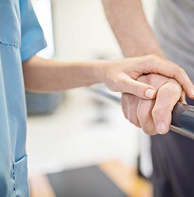 Therapist Assisting Patient — State College, PA — Back To Life Physical Therapy