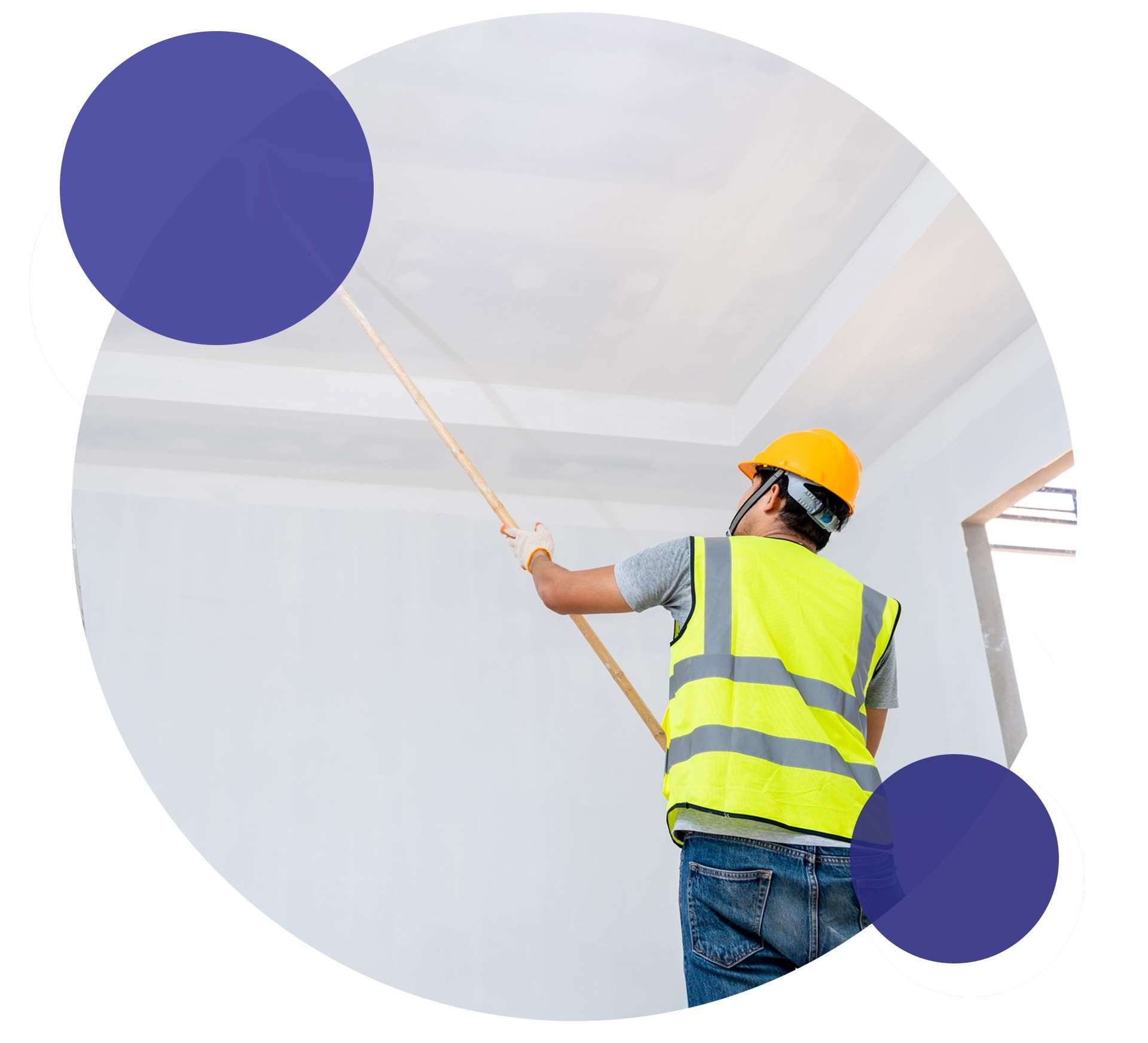 Interior painter on ladder painting ceiling during home renovation.
