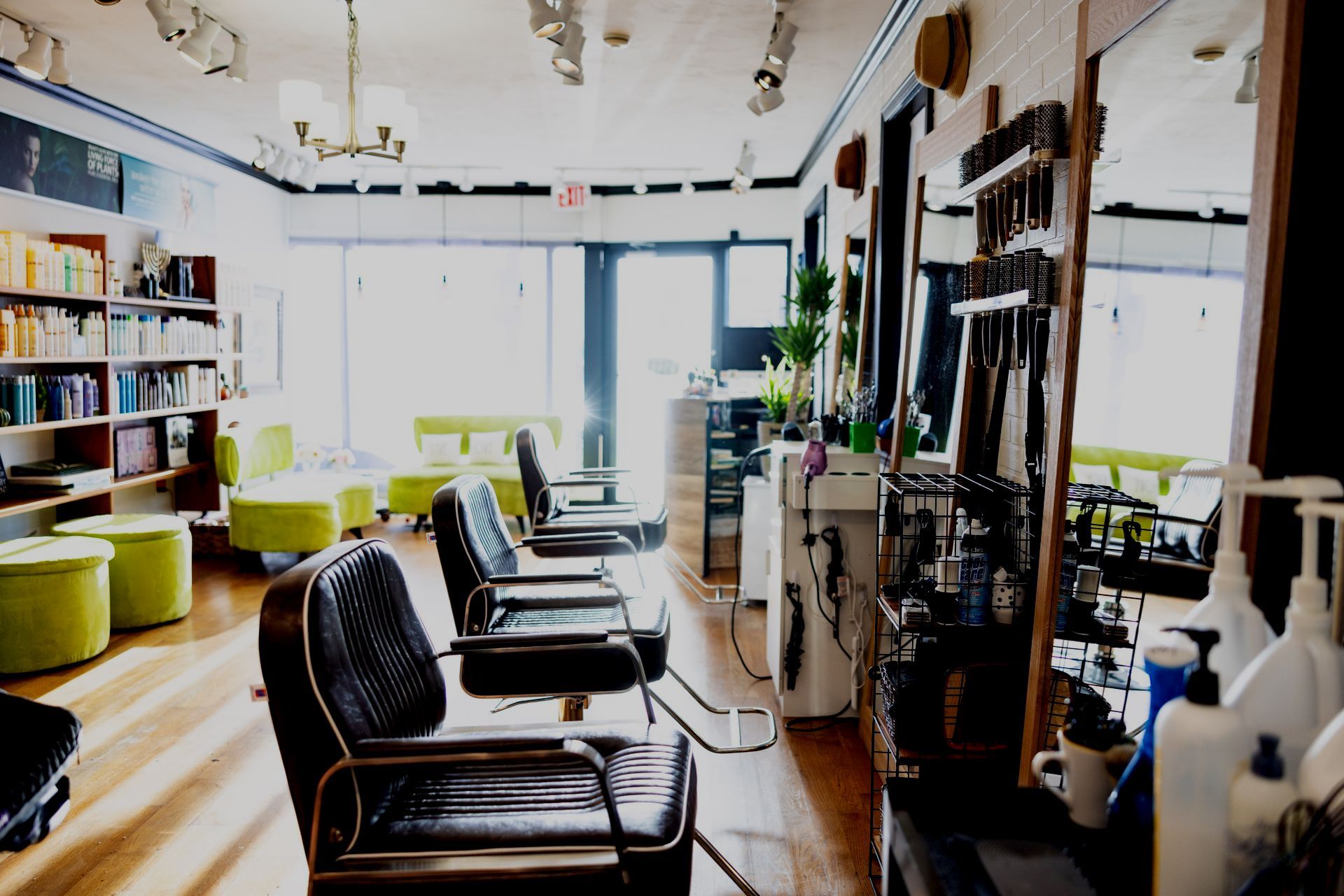 A hair salon with a lot of chairs and mirrors