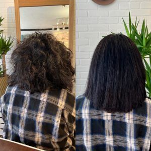 A before and after photo of a woman 's hair in front of a mirror.