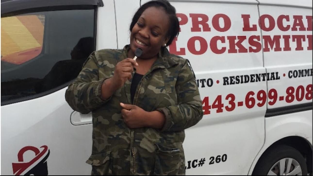 Customer with the Pro Local Locksmith van after a lock change in Baltimore