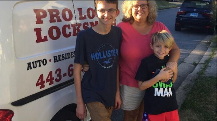 Family with the Pro Local Locksmith van after a home rekey in Baltimore
