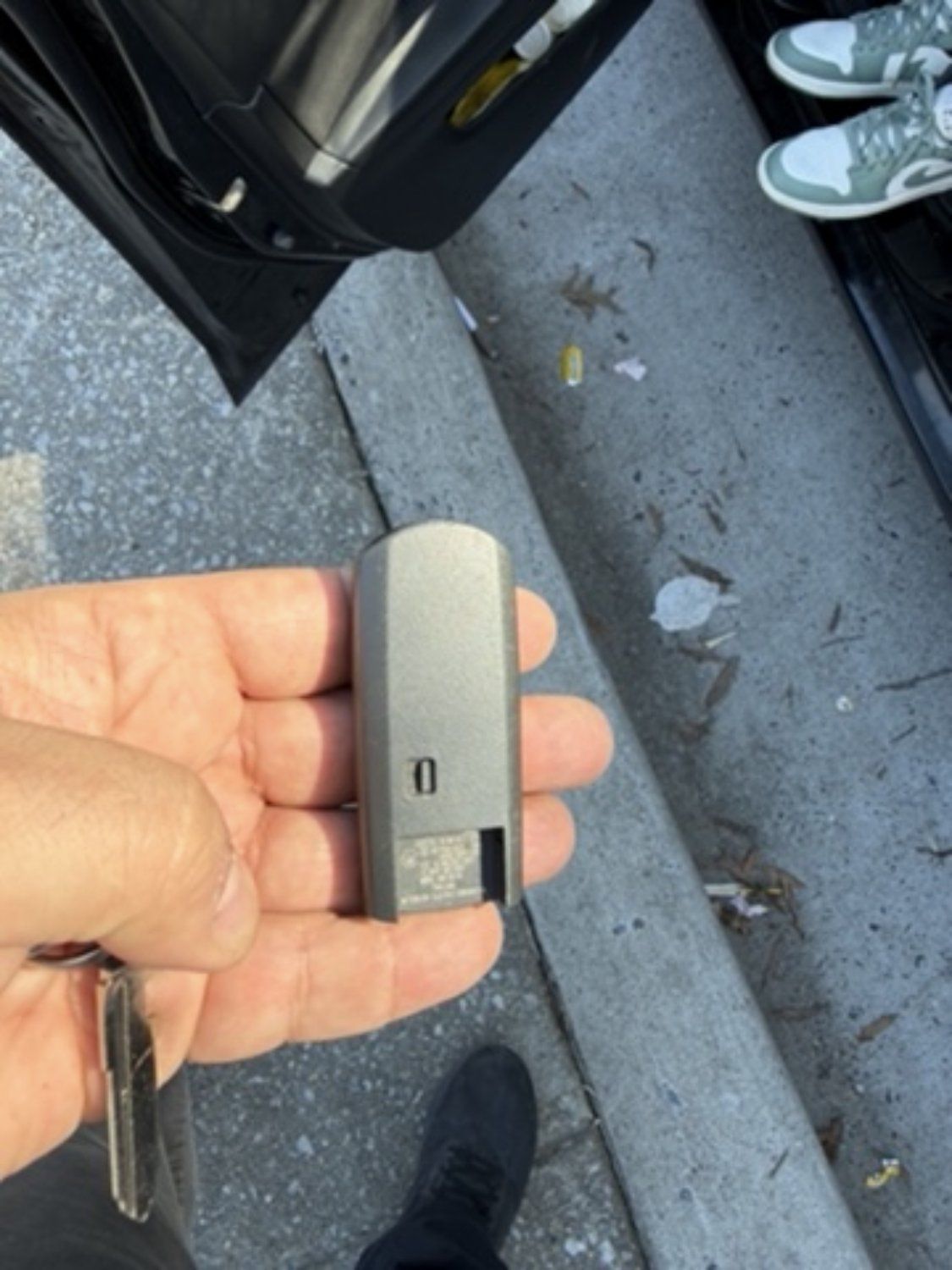 Smart key fob in hand, made by Pro Local Locksmith in Baltimore
