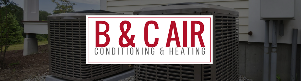 Air conditioning units with a sign that reads
