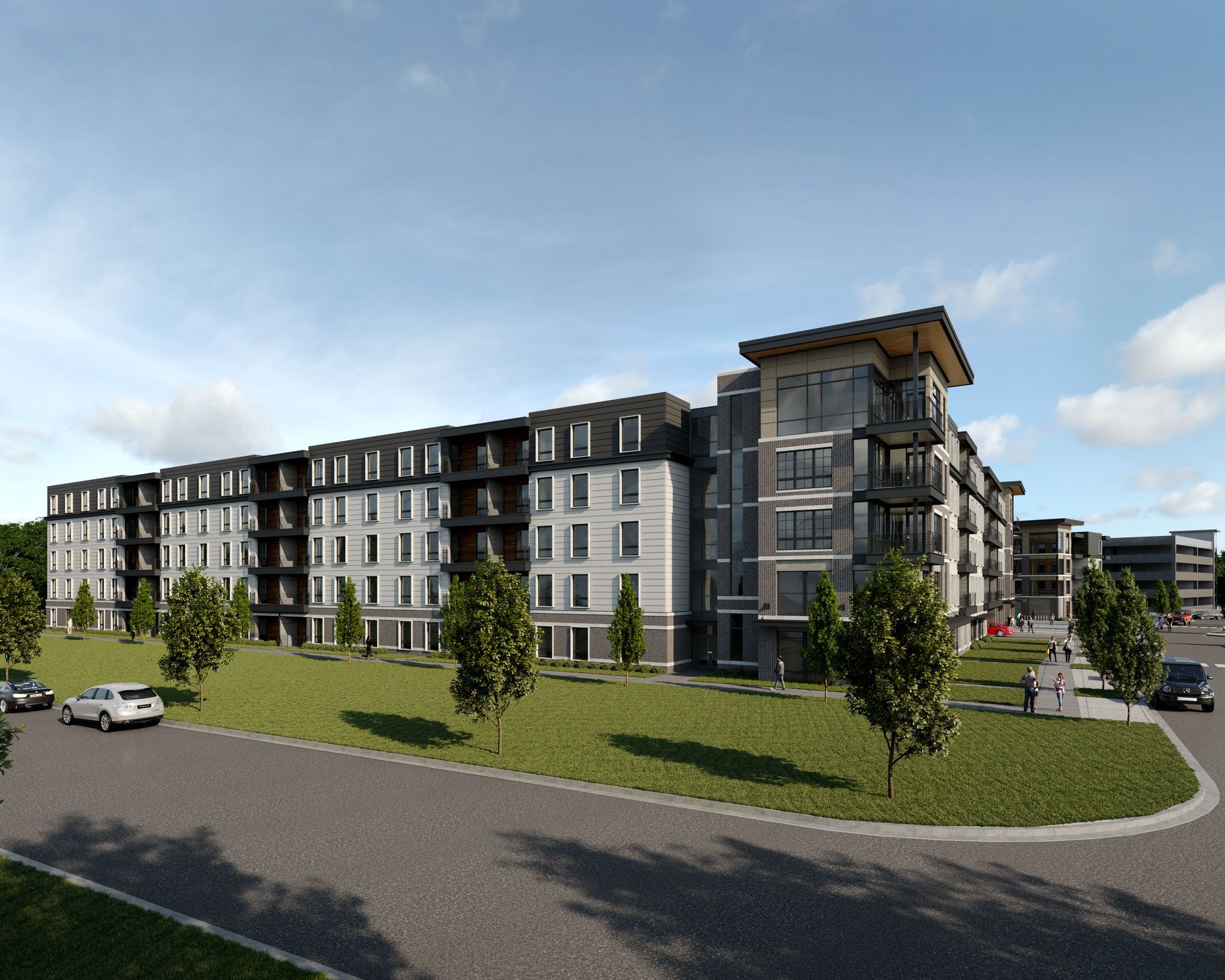 a large apartment building with cars parked in front of it at Vanguard at 16 Tech in Indianapolis, IN.