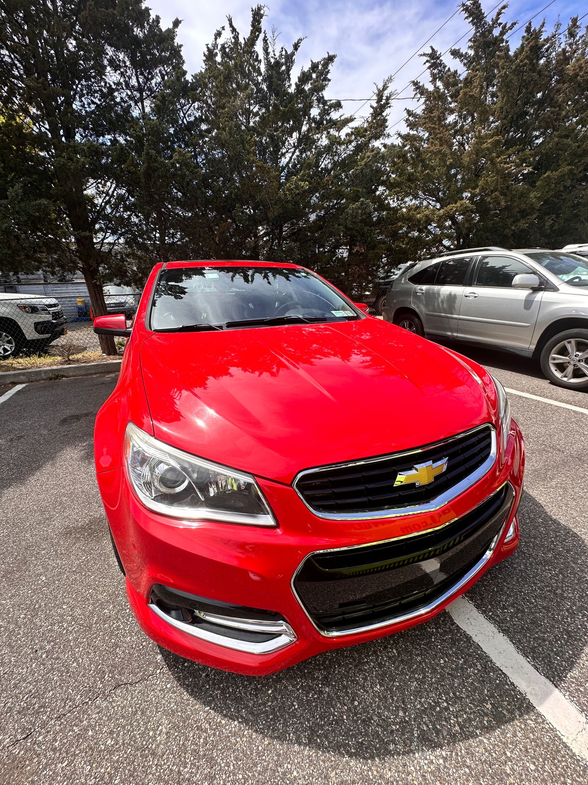 Red Chevrolet SS sedan parked outdoors on a sunny day. | Road Ready
