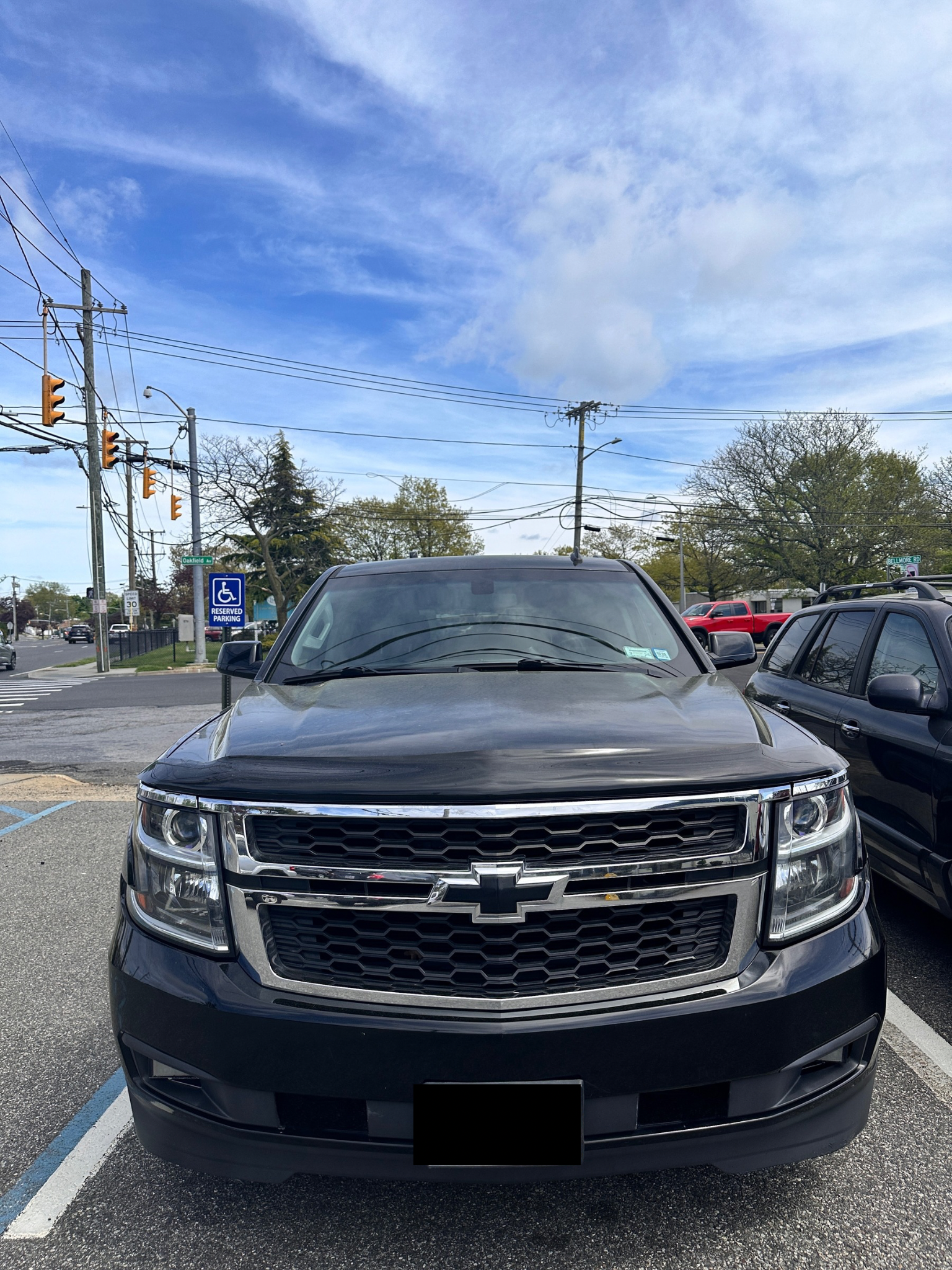 Black SUV parked outdoors with blue sky. | Road Ready