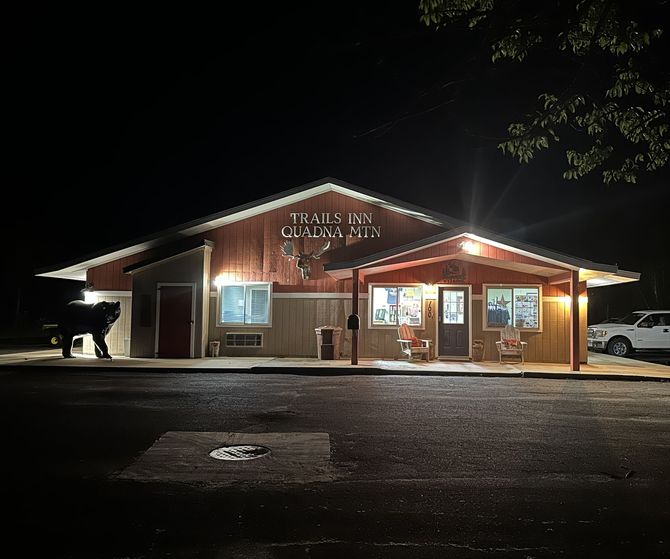 An image of the Trails Inn Quadna office at night. An image of the Trails Inn Quadna Motel & RV Campground office at night.