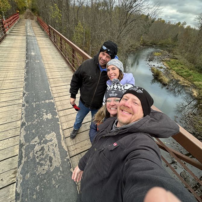 An image of owner Shawn Pehrson with friends. An image of owner Shawn Pehrson with friends on the ATV bridge in Emily, MN,
