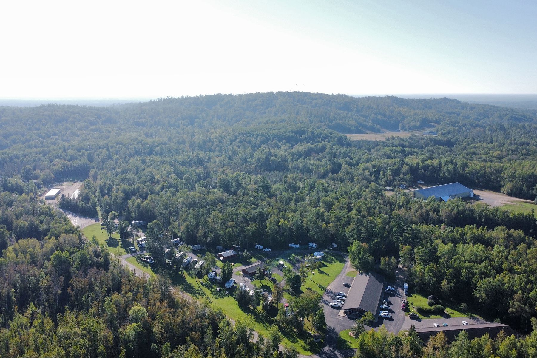 An Aerial view of the Trails Inn Motel, Quadna Mountain, and Snowmobile Paradise. An Aerial view of the Trails Inn Motel, Quadna Mountain, and Snowmobile Paradise.