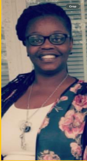 a woman wearing glasses and a floral jacket smiles for the camera