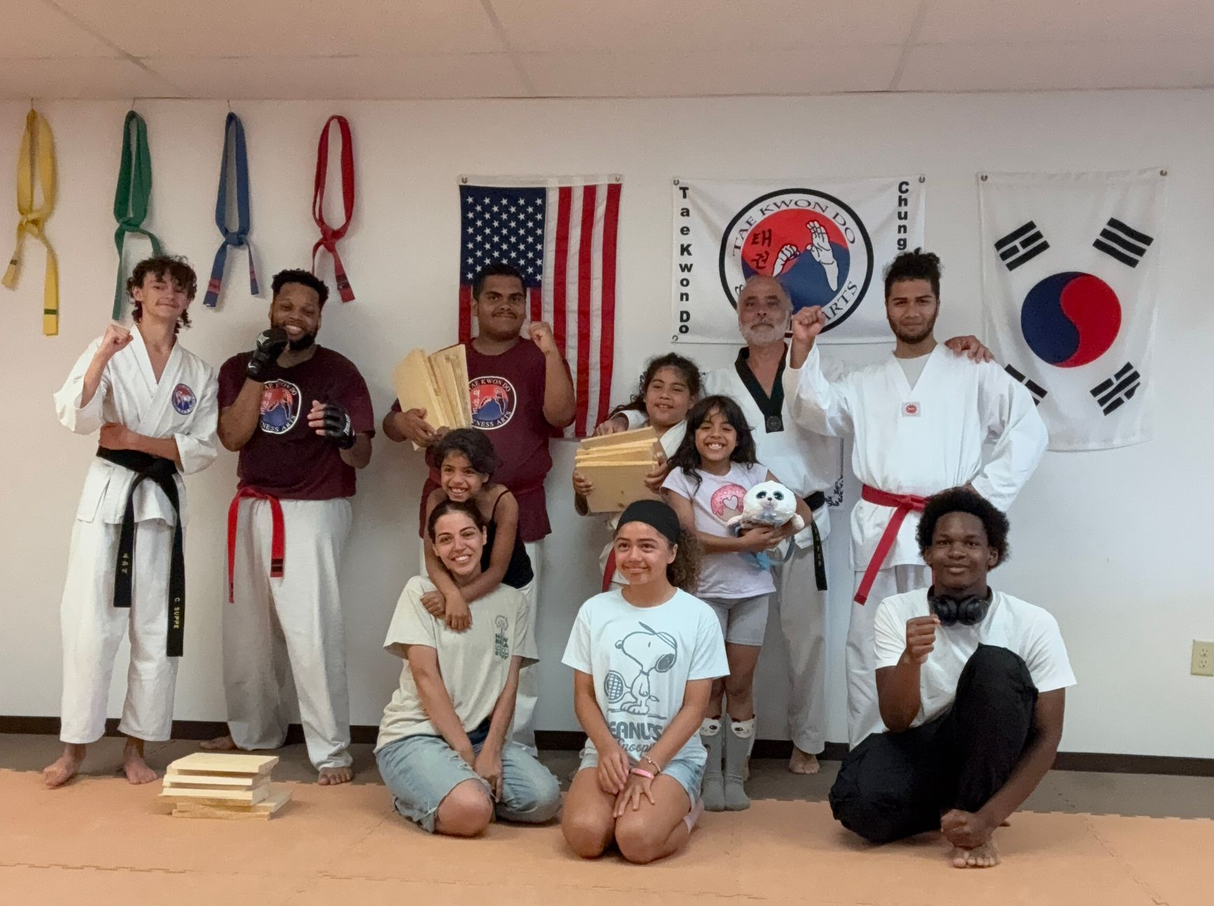 Two taekwondo athletes sparring, executing high kicks. Red and blue protective gear. Two taekwondo athletes sparring, executing high kicks. Red and blue protective gear.