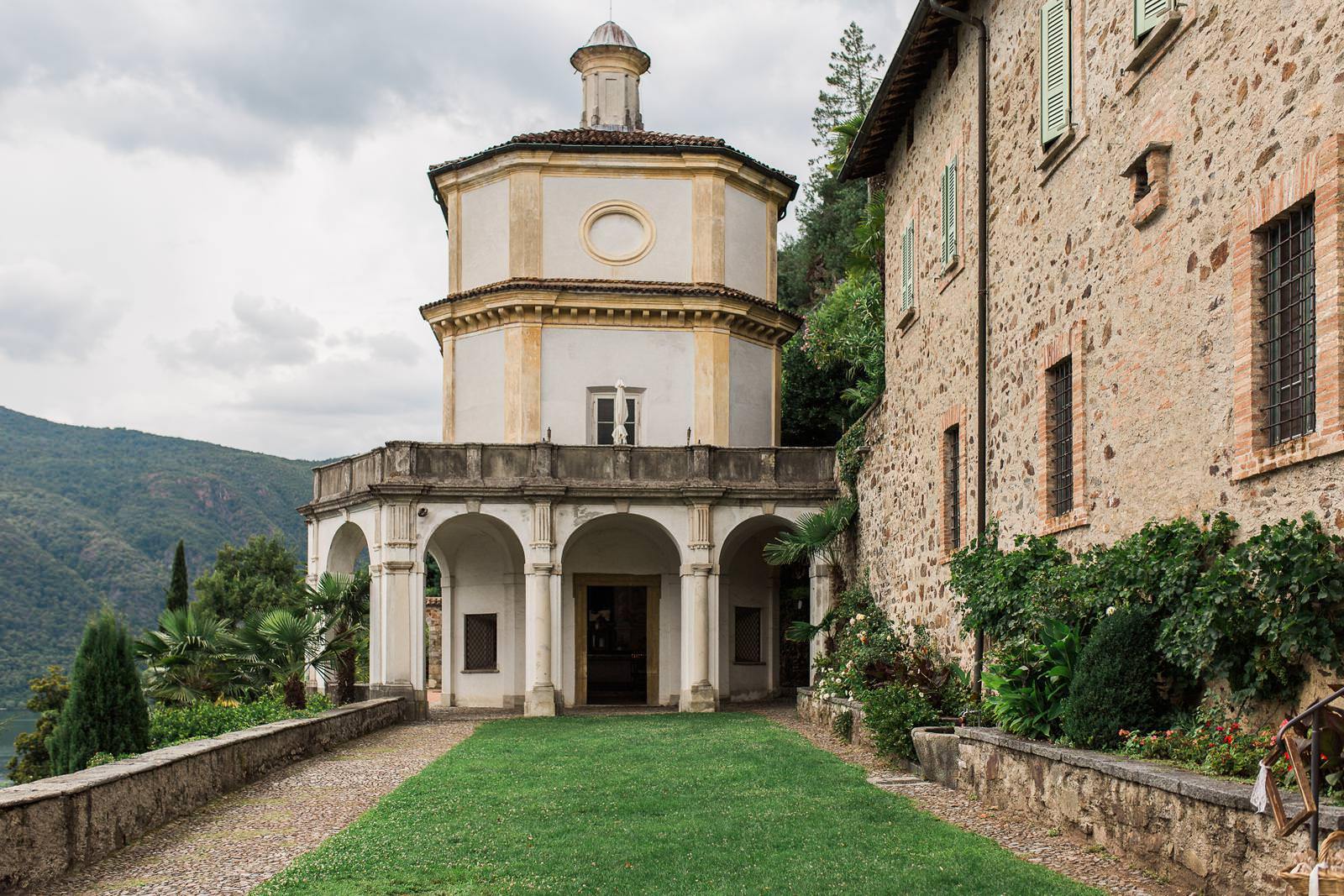 A large stone building with a circular tower on top of it.