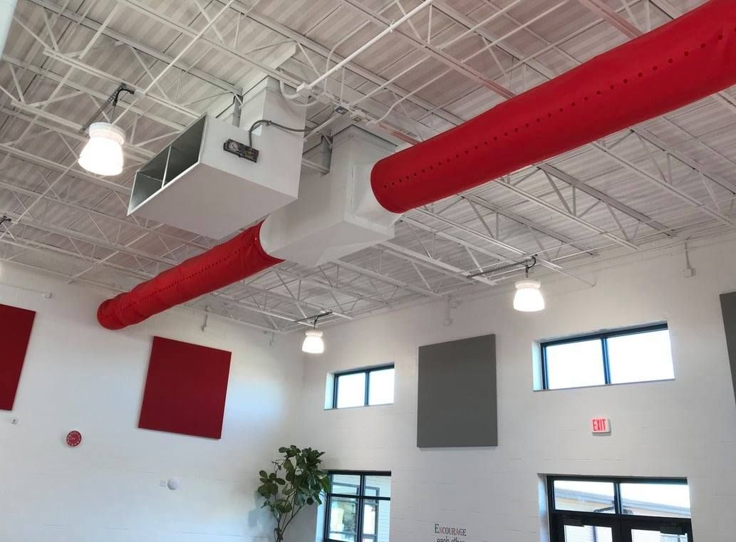 A White Interior With Red Ductwork. Hulett Installs Commercial Ductwork in Missouri.