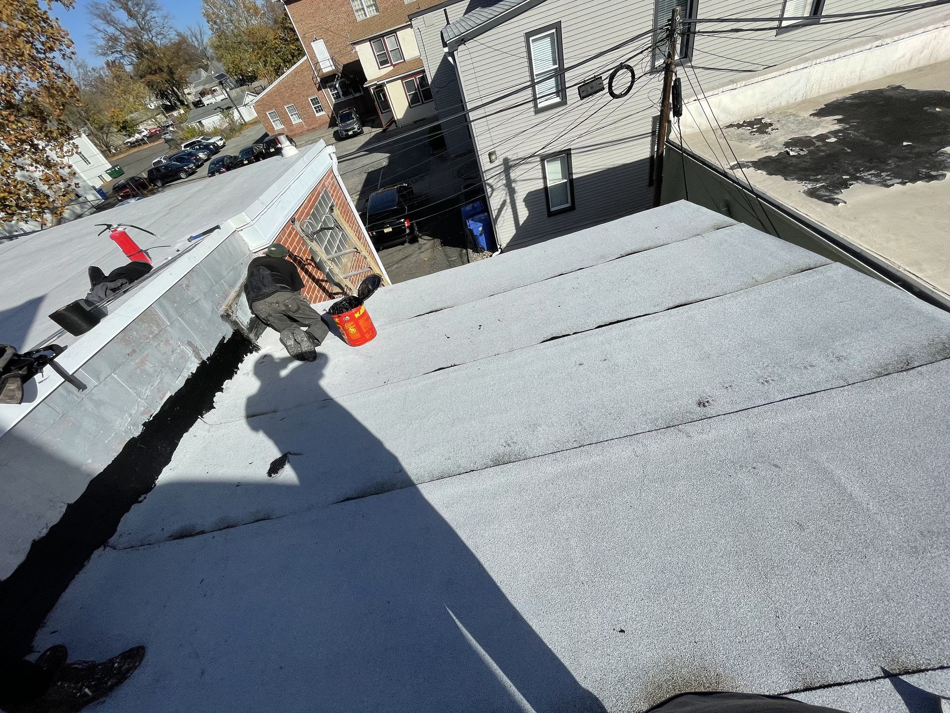 A close up of a roof with a chimney on top of it.