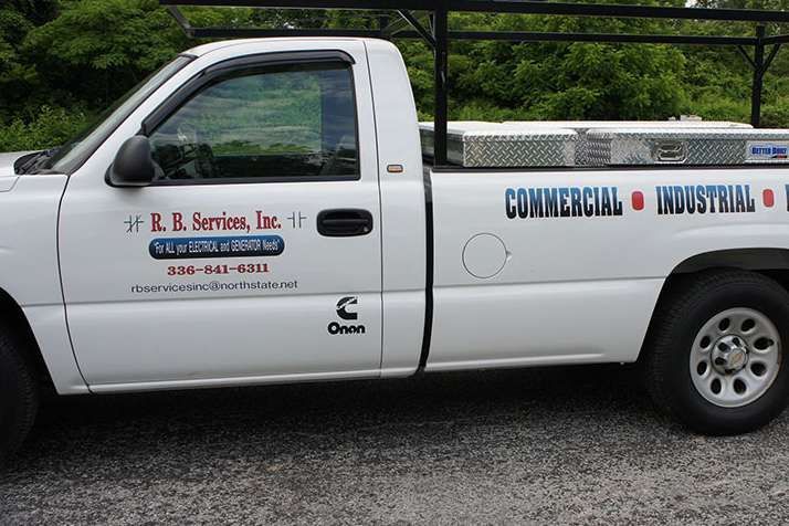 A white truck that says commercial industrial on the side